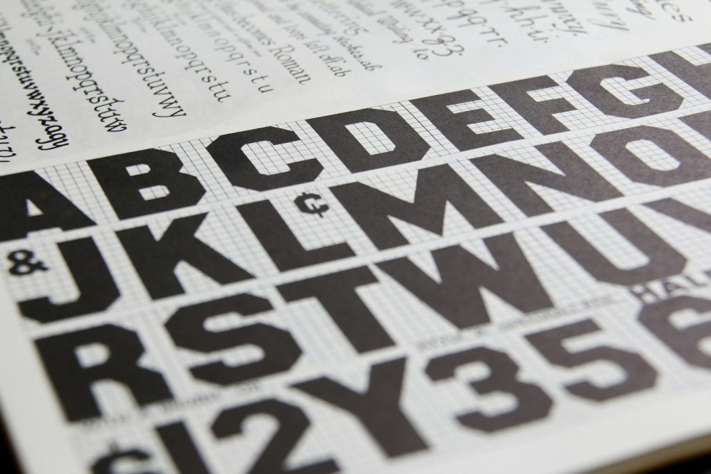 a close up of a book with letters and numbers