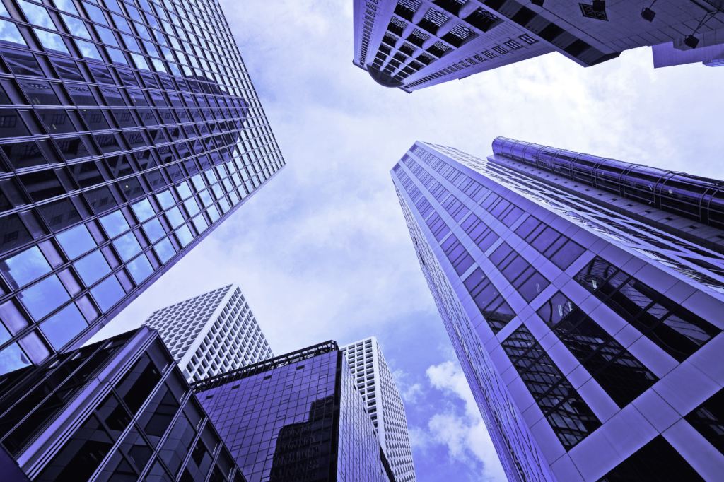 Upward view of modern, sleek skyscrapers, linked to business growth, entrepreneurship & Hong Kong company formation