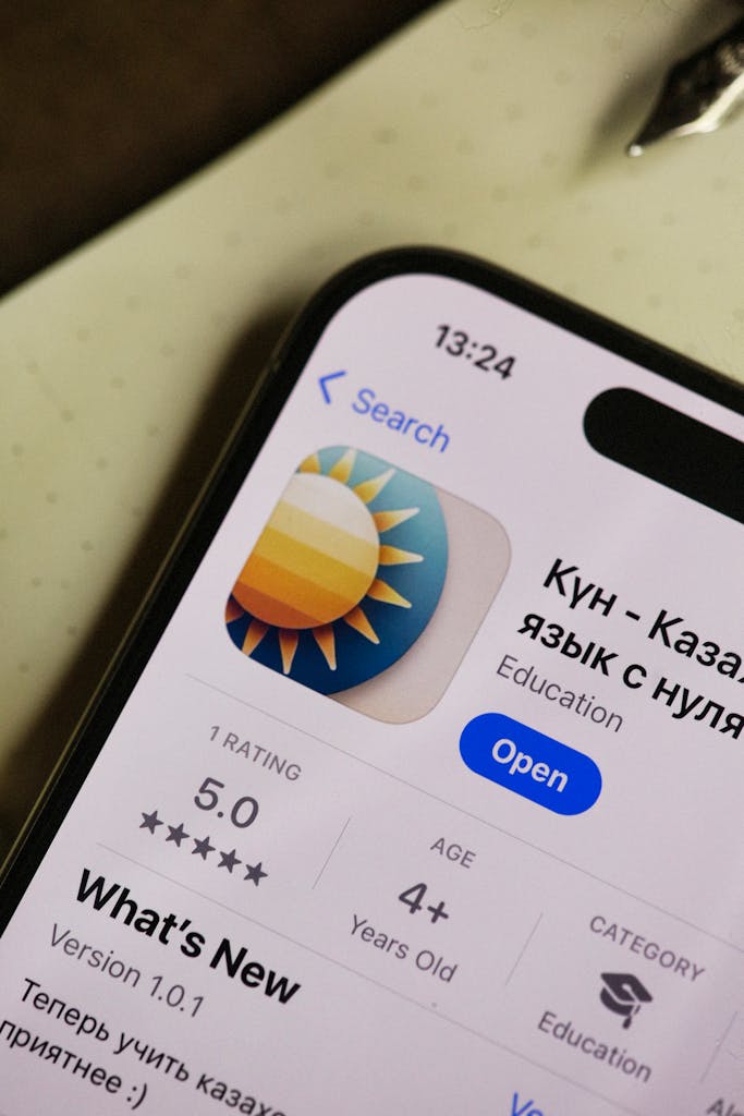 Close-up of smartphone with an educational app on display, showcasing user interface.