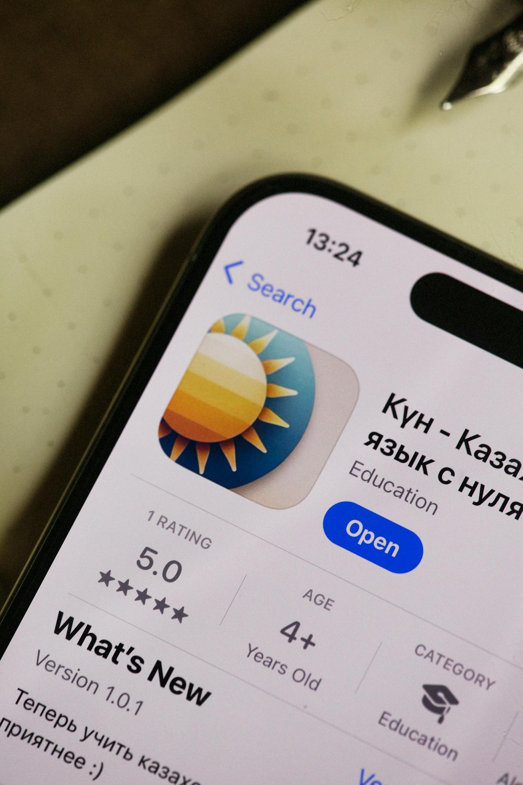 Close-up of smartphone with an educational app on display, showcasing user interface.