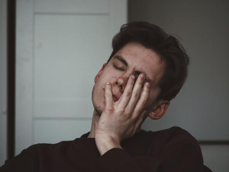 man hand on eye