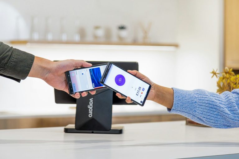 Mobile payment transaction being completed with phone.