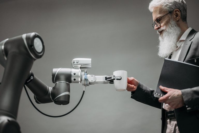 man taking a cup from robot