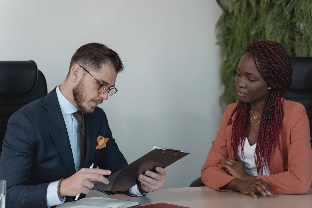 white man and black girl working