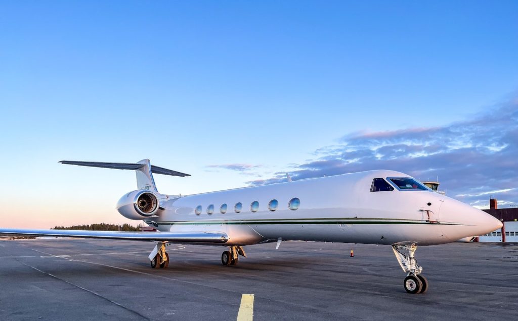 a private jet sitting on the tarmac of an airport