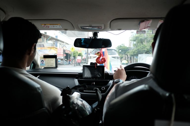 Experience a typical taxi ride through the streets of Bangkok, Thailand.