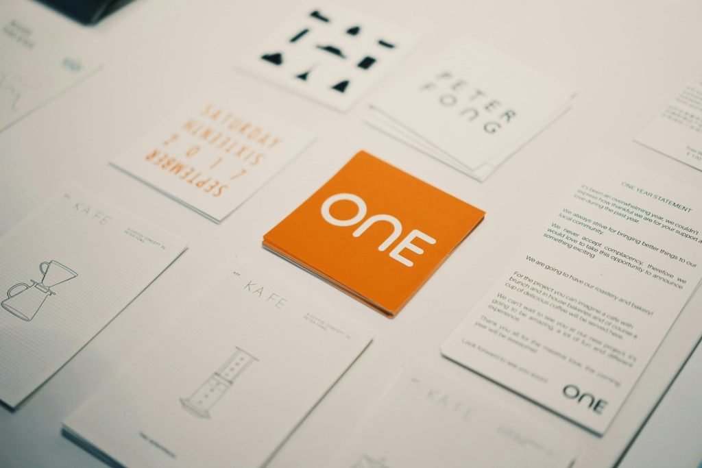 Orange card with "one" logo surrounded by other cards